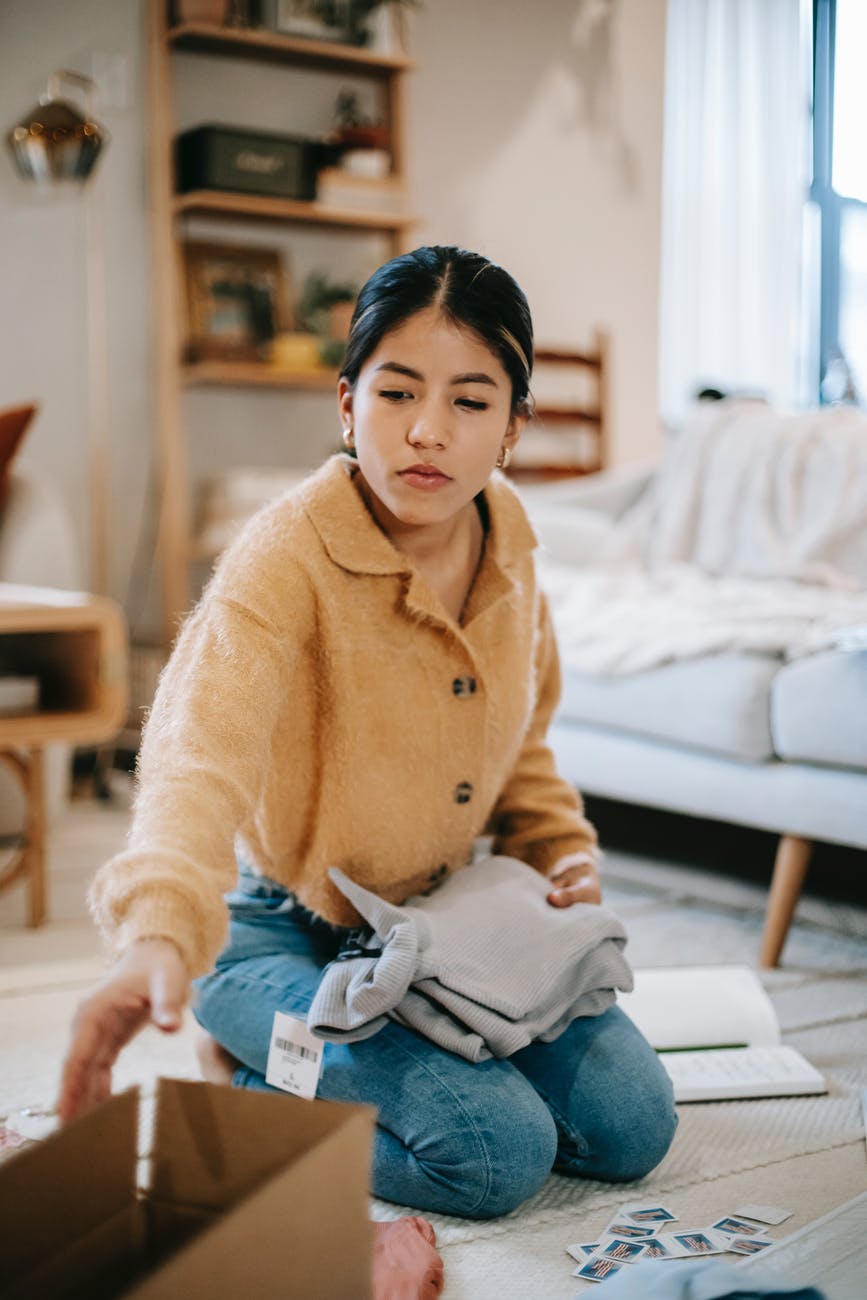 woman decluttering to reduce stress and anxiety
