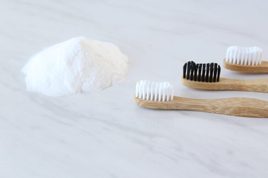 Baking soda with bamboo toothbrushes