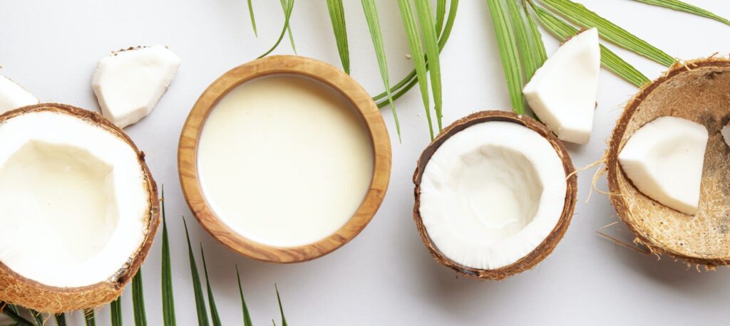 Coconut and bowl of coconut milk