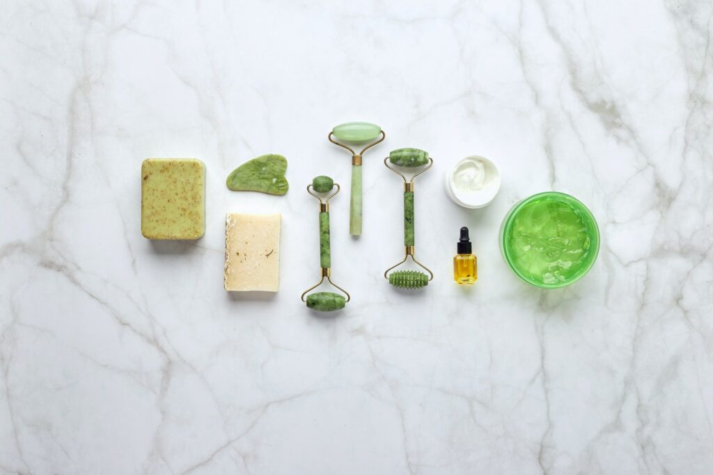 Roller massage of the face. Flat lay, top view