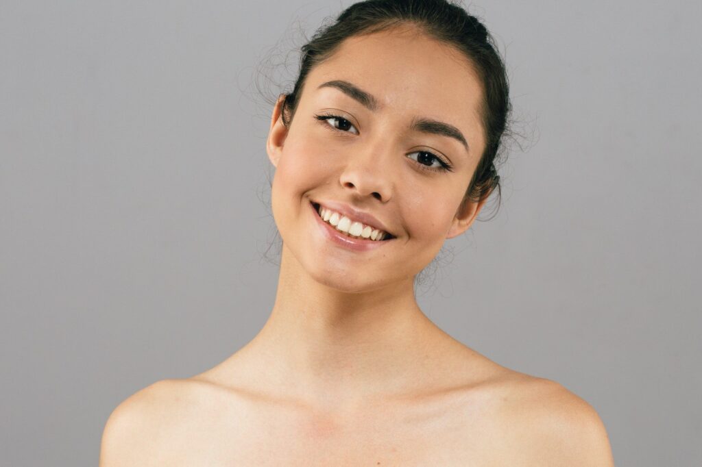 Tanned skin happy smile woman face