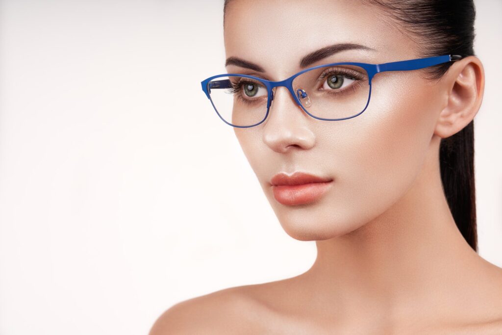 Woman with long eyelashes in eyeglasses