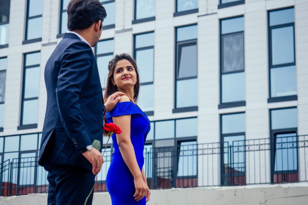 long haired brunette indian woman in blue dress with her handsome boyfriend