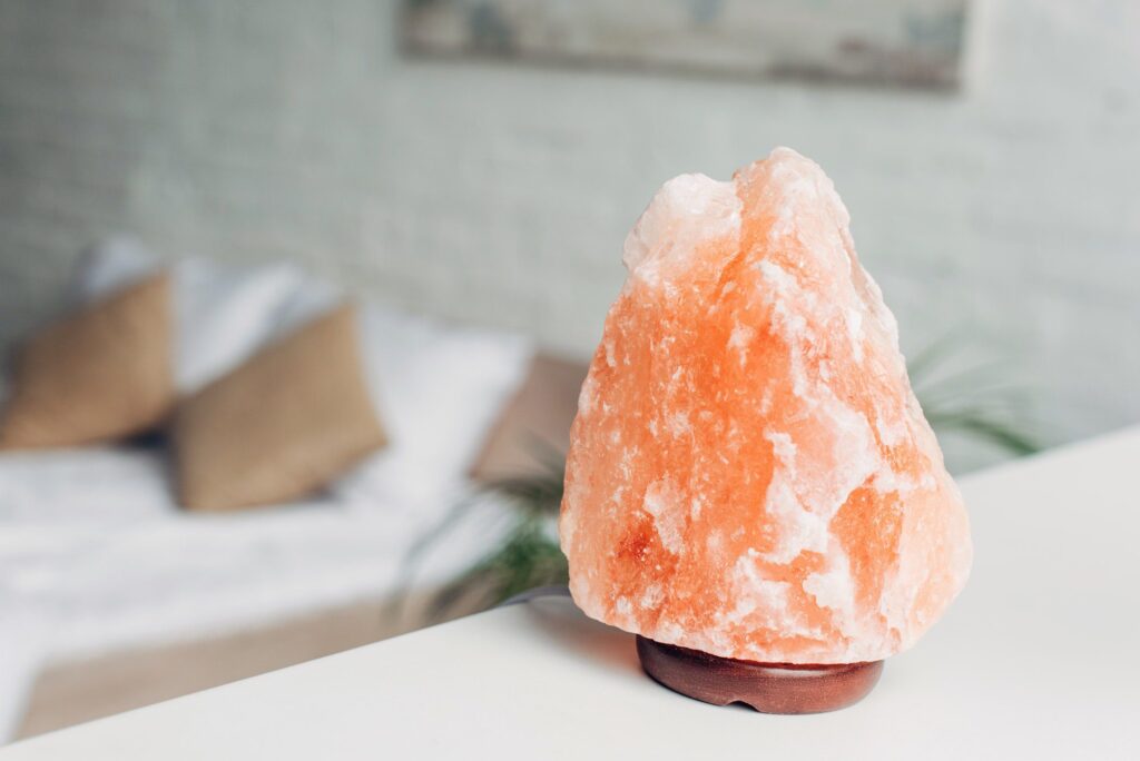 selective focus of Himalayan salt lamp in bedroom